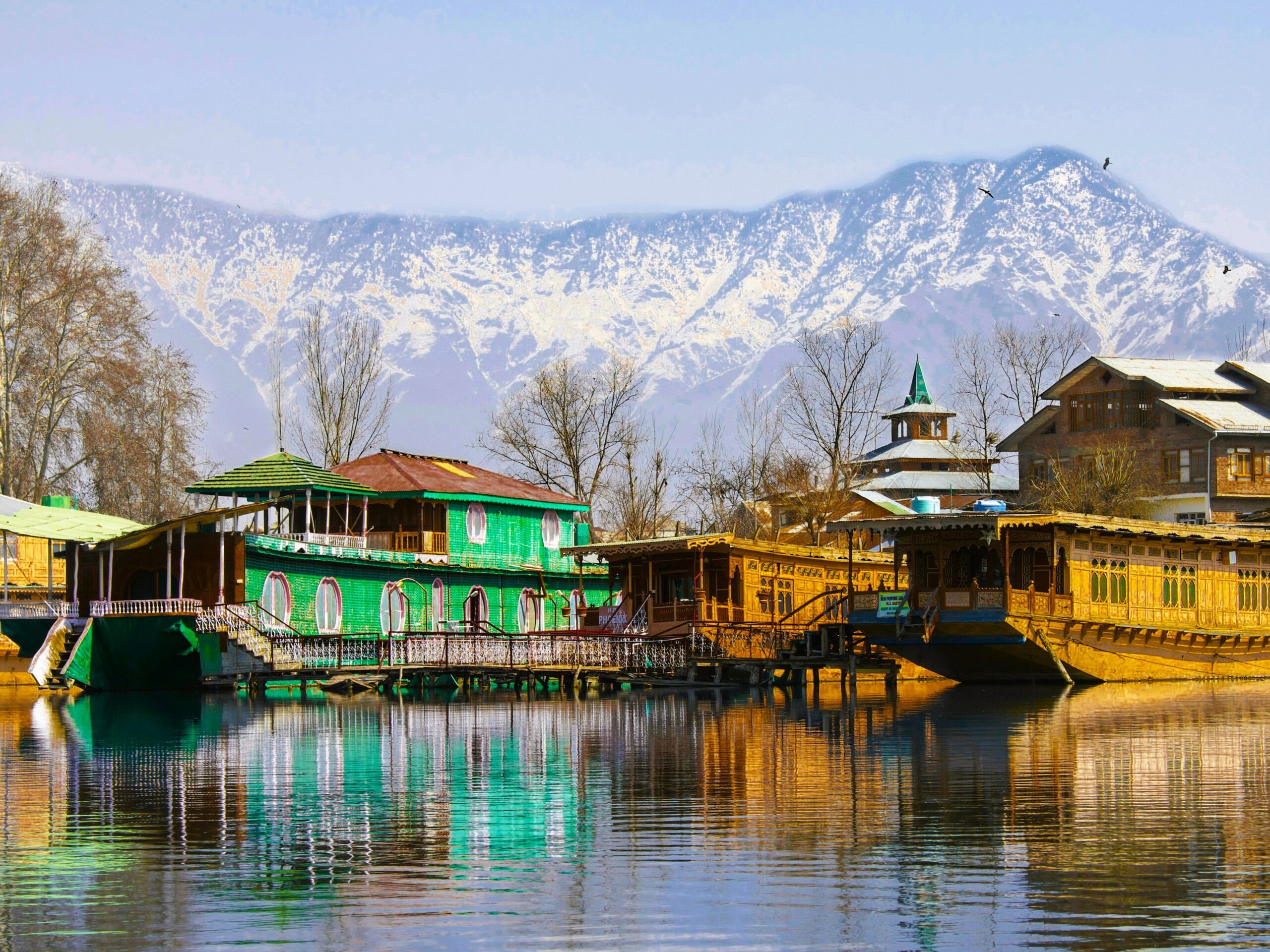 Traditional Kashmir houseboats on Dal Lake included in Kashmir Highlights Tour package
