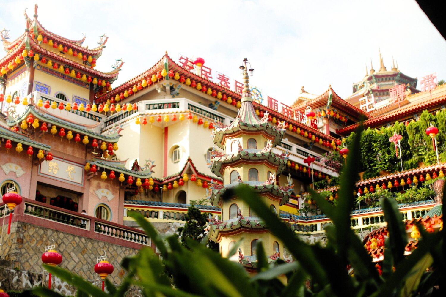 Traditional Chinese temple decorated with colourful lanterns in Kuala Lumpur featured in Malaysia Tour Package