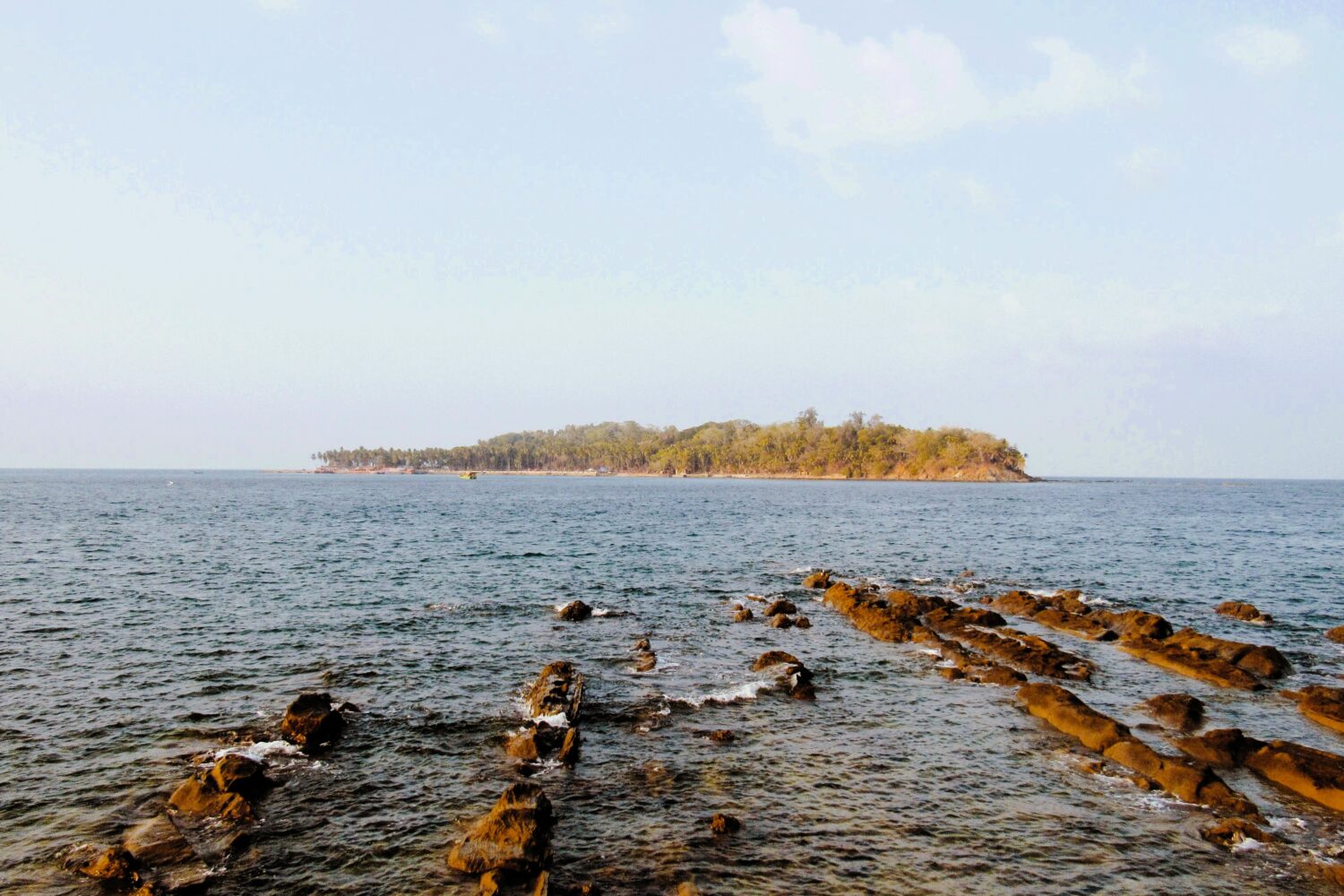 Scenic coastal landscape with rocky shoreline and island views featured in Andaman Island Tour Package