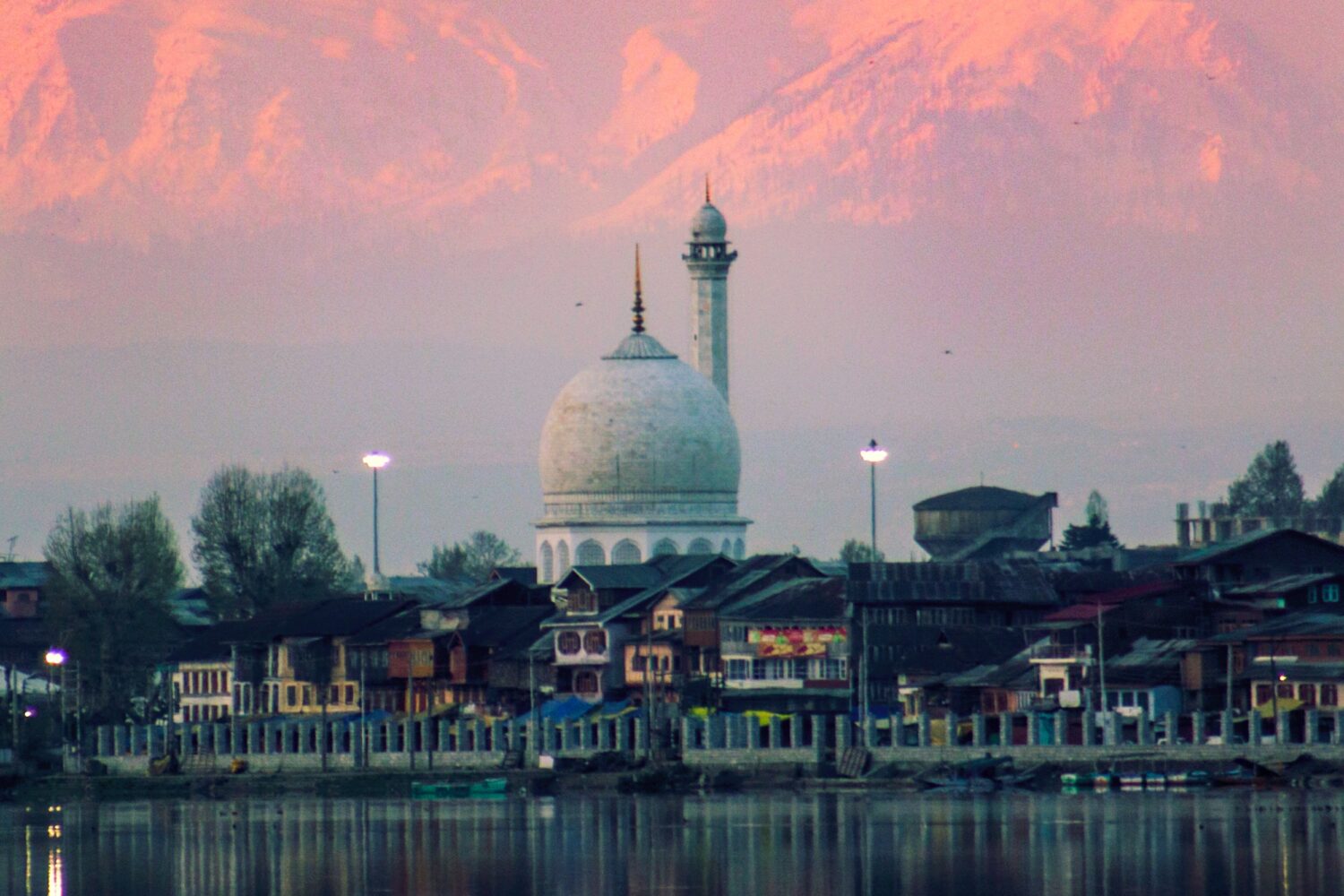 Hazratbal Shrine overlooking Dal Lake with mountains Scenic green mountain valley and pine forests